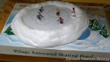 Department 56 Village Animated Skating Pond comes in original box. Appears complete.