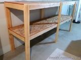 Sturdy wooden shelving unit measures 8' wide x 48