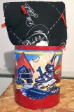 Sports themed tin wastebasket is 11