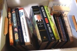 Books including Duck Dynasty books, Decision Points by George W. Bush, Wausau West Alumni, bathroom