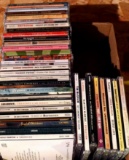 Assorted CDs including Shania Twain, Martina McBride, Reba McEntire, The Beatles, Beethoven, Diamond