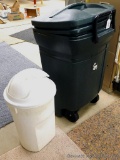 Rubbermaid wheeled garbage tote with handle and lid, plus another garbage can. Rubbermaid can is 36
