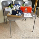 Samsonite folding card table with four chairs. Table is as sturdy as they come, chairs are in good