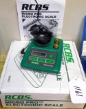 RCBS Micro Pro electronic scale with original box and manual, plus calibration weights. Works.