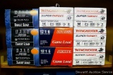 Nine full boxes of 12 gauge shot shells, Game and Target loads by Federal and Winchester.