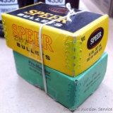 Nearly empty boxes of .30 cal 180 grain round nose bullets by Speer and Sierra.