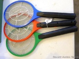 Three bug zapper rackets. Indicator light comes on when button is pressed on each, but no mosquitoes