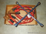 Jumper cables that you won't mind lending out, plus a Ken-tool multi-lug wrench.