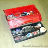 Plano tool box filled with lots of plumbing supplies including copper pipe cutters, solder,