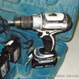 Makita 18 volt lithium cordless drill with 2 extra batteries, charger and carrying case. Runs.