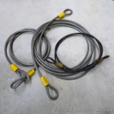 3 Coated lock down cables with loops on ends, longest is approx. 15 ft.