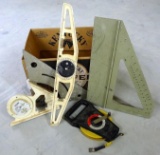 Lufkin 100ft tape measure and assortment of aluminum and plastic squares.
