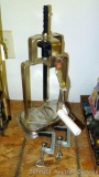 Most or all of a hand driven press, stands 18