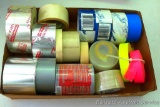 Box full of various sizes and types of tape.