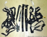 Two body harnesses for hunting have a 300 lb. weight limit. Lot also has 3 extra straps.