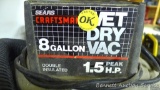 Sears Craftsman 8 gallon wet/dry vacuum, 1.5 hp, includes hose with wand. Inlet hose is taped.