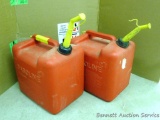 No Shipping. Two 5 gallon gas totes are filled with gasoline have nozzles and air intake.