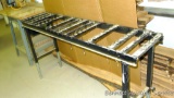 Metal stand with adjustable legs has ball bearing rollers is 55