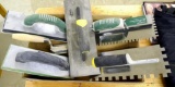 Three stainless steel notched trowels; 2 padded floats.