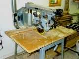 Delta Model 10 Deluxe Radial Arm Saw with Automatic Brake with single phase ball bearing motor. Has