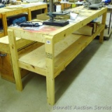Homemade heavy duty work table with lower shelf framed with 2x4 lumber is 24