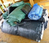 Nice assortment of tarps for firewood, lumber drying, other. Stack as pictured is approx. 6' x