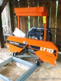 Wood-Mizer LT10 band sawmill with 10 hp Briggs & Stratton Vanguard engine. Saw is under roof and