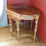 Pretty antique side table is in good shape. Table has birds eye maple accent on top. Measures