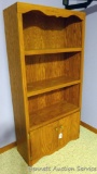 Bookcase with lower storage cabinet. Measures 64