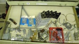 Contents of drawer includes hinges, hasps, ring pulls, hooks, muffler clamps, galvanized pipe