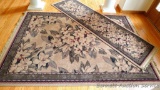 Area rug and runner with a muted magnolia pattern by Shaw Rugs. Both are in very good condition.