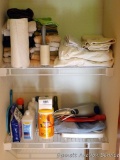 Bathroom items including towels, bar soap, scale, sheets, massager, partials of body wash, etc. No