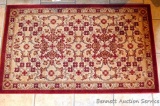 Pretty rubber backed area rug measures 30