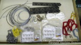 Contents of drawer includes rubber coated hangers, steel cable rail, small chain sections, chain