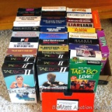 VHS tapes including The Outlaw Josey Wales, 20-minute Workout, Going Overboard, High Plains Drifter,