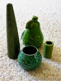 Four green pottery pieces, tallest is nearly 10
