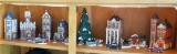 Dept. 56 Christmas village pieces include City Clockworks, a church, Haberdashery, First