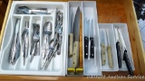 Stainless steel flatware set, plus two Pampered Chef knives and some other knives.