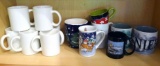 Assortment of coffee mugs including two Mt. Ranier oversized mugs.