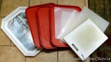 Two heavy duty plastic cutting boards, plus a variety of trays.