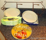 Pretty stoneware glazed baking dishes; plate display with plates; corn on the cob servers. Round