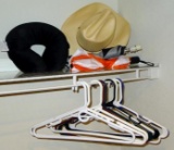 Milano Hat Co. was made in USA; neck pillow; a couple umbrellas; hangers.