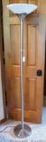 Brushed stainless finish 6' floor lamp is in good working condition.