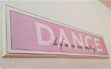 Dance sign around two feet long.