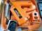 Paslode Impulse cordless framing nailer with 2 batteries, charger, framing fuel, manuals, and case.