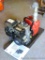 Red Lion pump model RLGF-8 has Briggs & Stratton 3.5 HP motor model 91232. Unit is mounted to wood