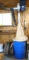Dust collector system has a Leeson model C6C34FK2C motor, runs. Includes a 55 gal barrel and lots of