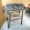 Wolfcraft Router Station 640 comes with a miter. Stands about 32
