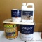 Gallon of Quikrete concrete stain appears to be full; gallon of Valspar garage floor coating base