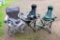 Two folding lounge chairs and one folding camp chairs with bags. One lounge chair is Ozark Trail